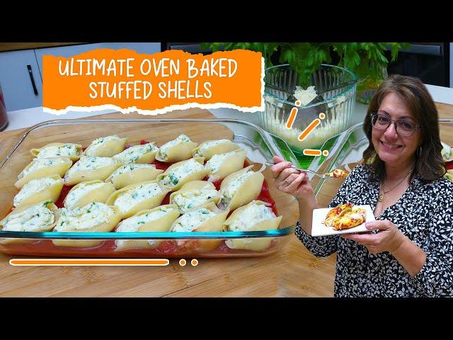 A wider shot of the baking dish with all the stuffed shells ready to go in the oven.