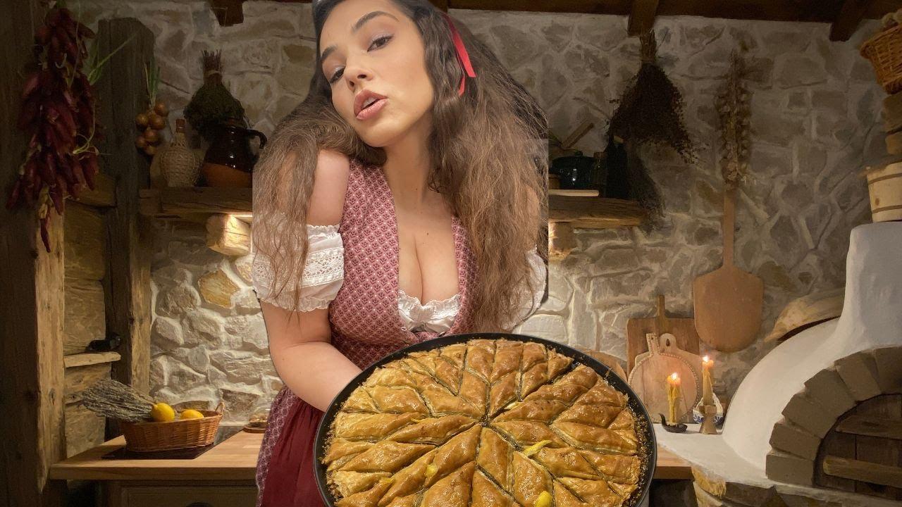 A rustic kitchen scene with a woman making baklava.