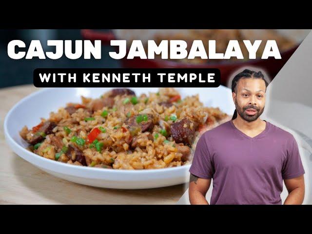 a person serving a plate of Chicken Jambalaya