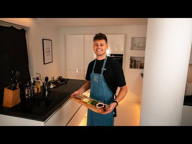 Chef preparing tuna tataki in a restaurant kitchen