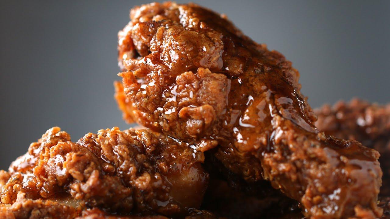 crispy fried chicken being glazed