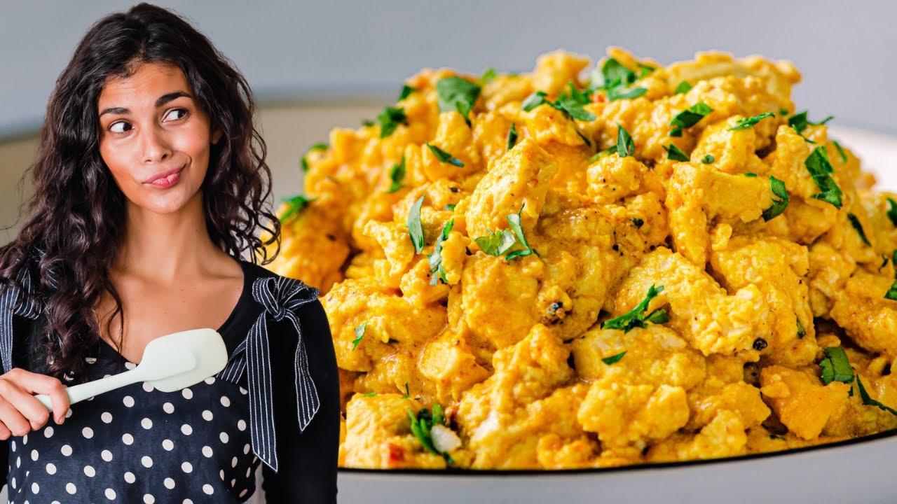 A person enjoying a plate of Moroccan Tofu Scramble