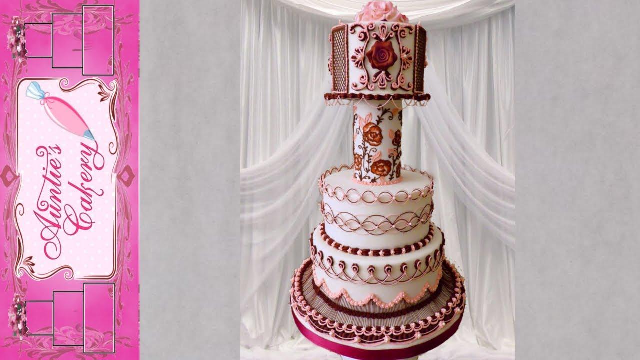 A beautifully decorated Maroon Marvel cake on a cake stand