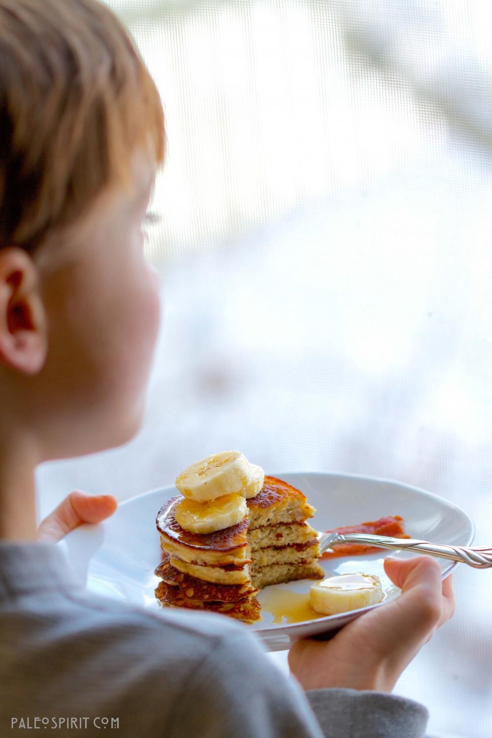 A person enjoying banana coconut pancakes