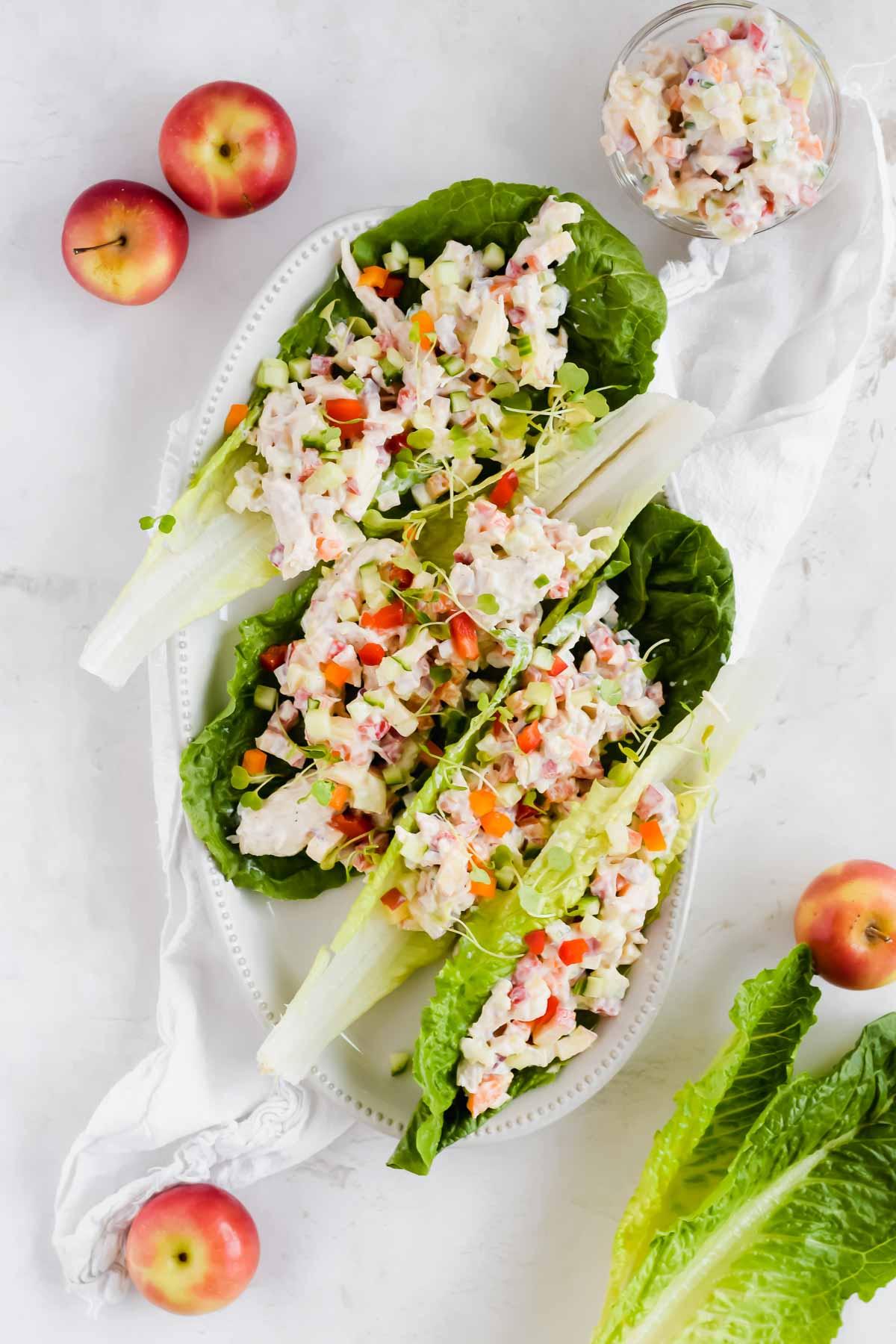 A vibrant photo of the completed dish; several lettuce wraps filled with chicken salad