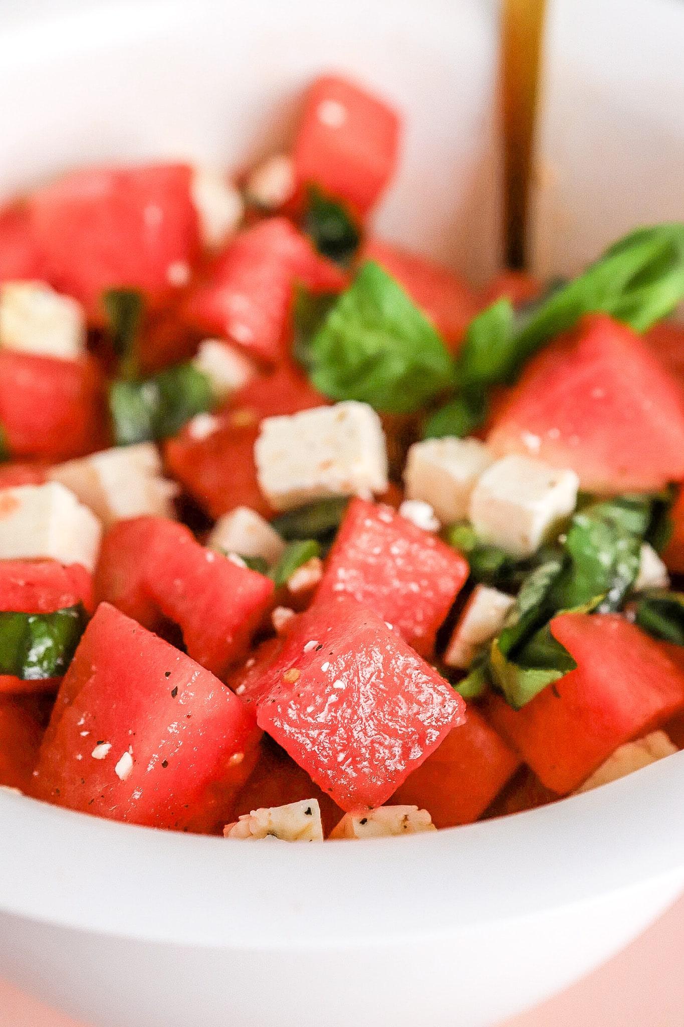 Watermelon and feta salad with fresh mint, close-up shot
