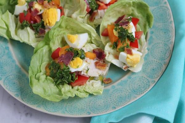 A platter of several Cobb salad lettuce wraps