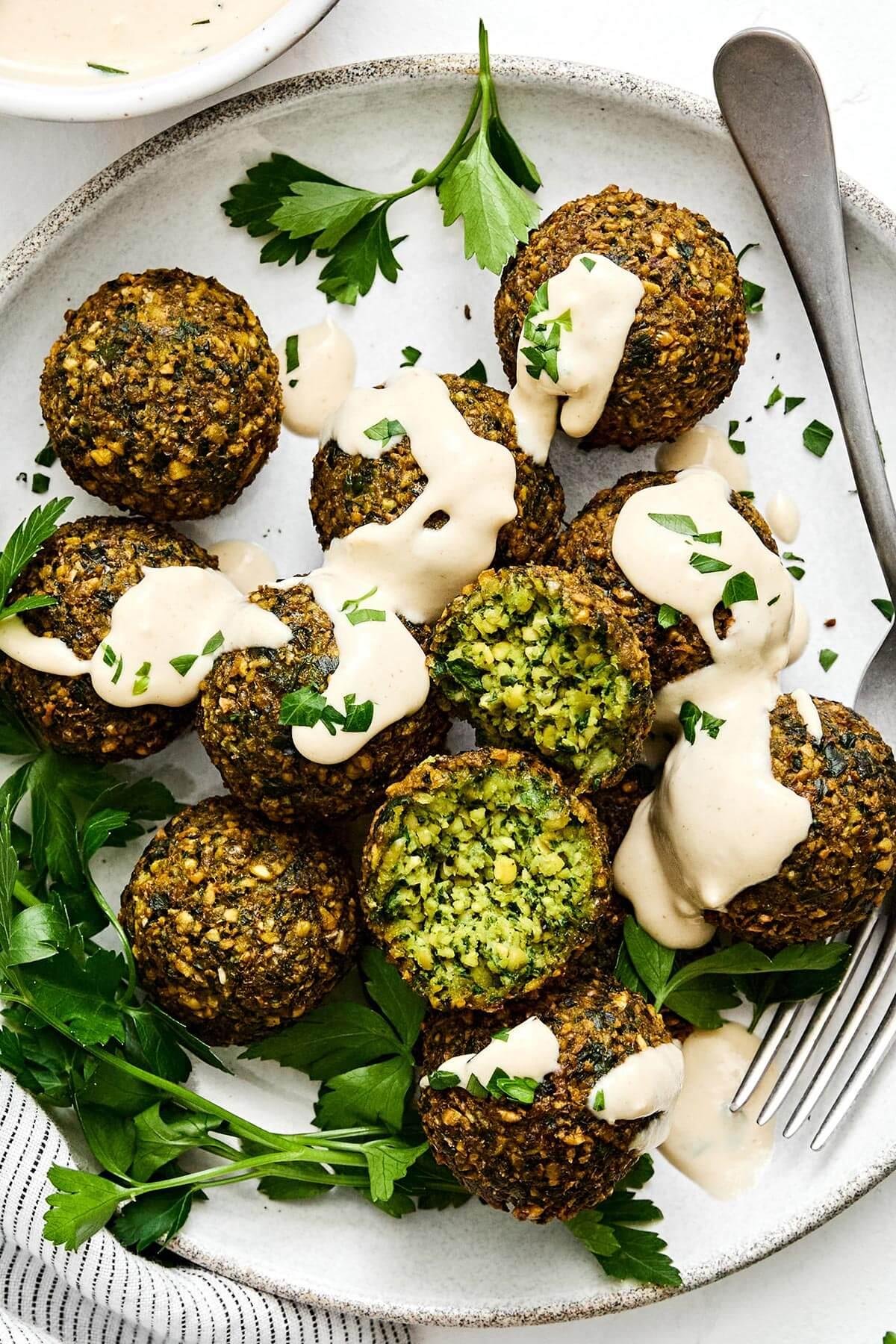 crispy golden falafel balls with vibrant lemon tahini dressing