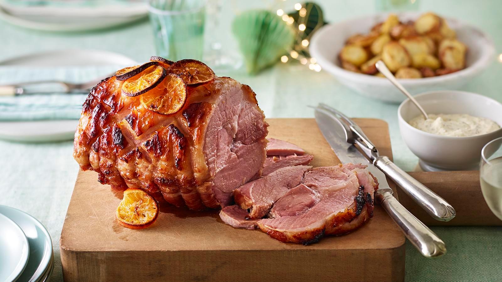 Christmas ham with clementine glaze, close-up shot showcasing the glistening glaze