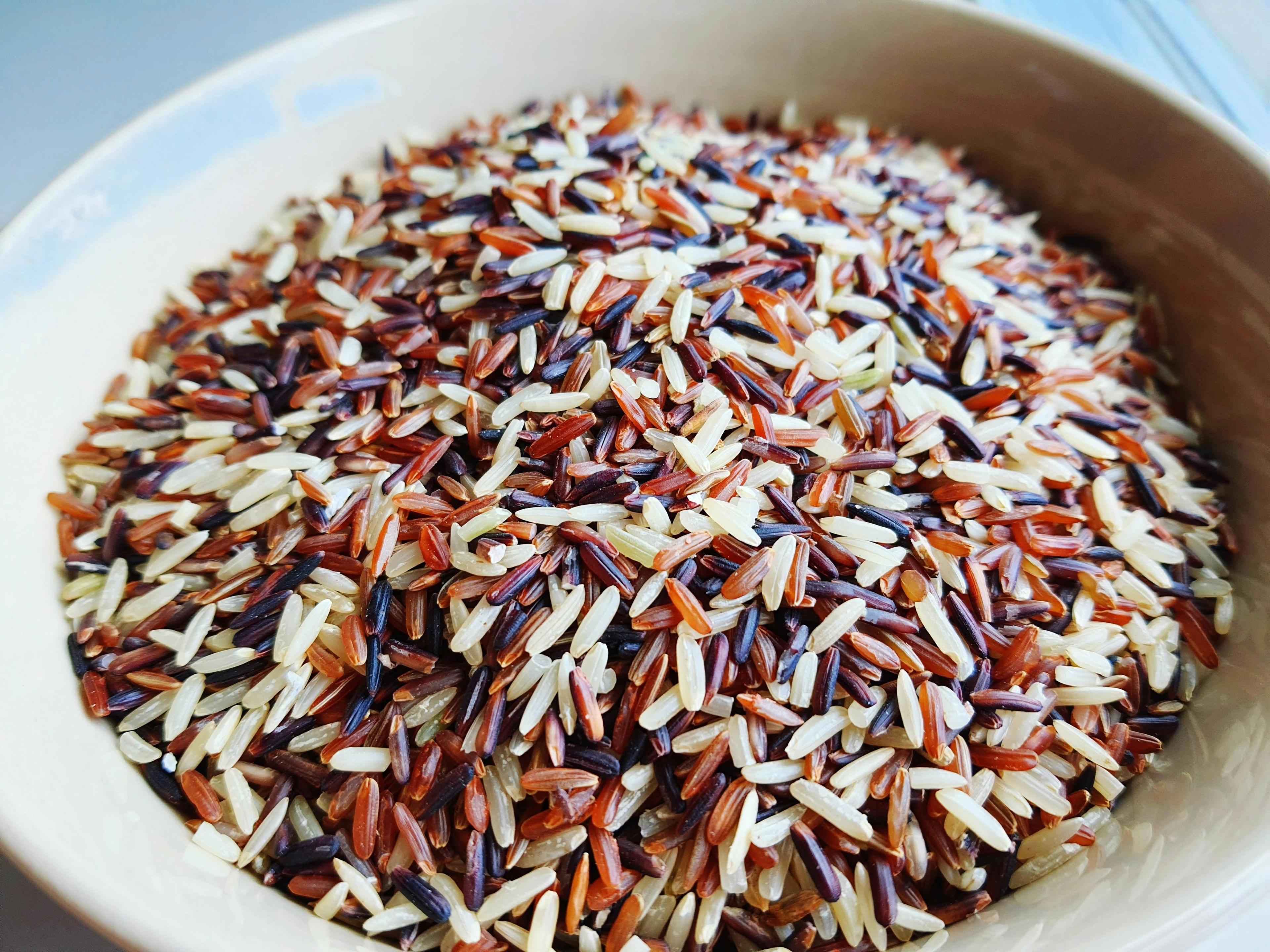Close-up shot of a single serving of the brown rice bowl, highlighting the texture and colors of the ingredients.