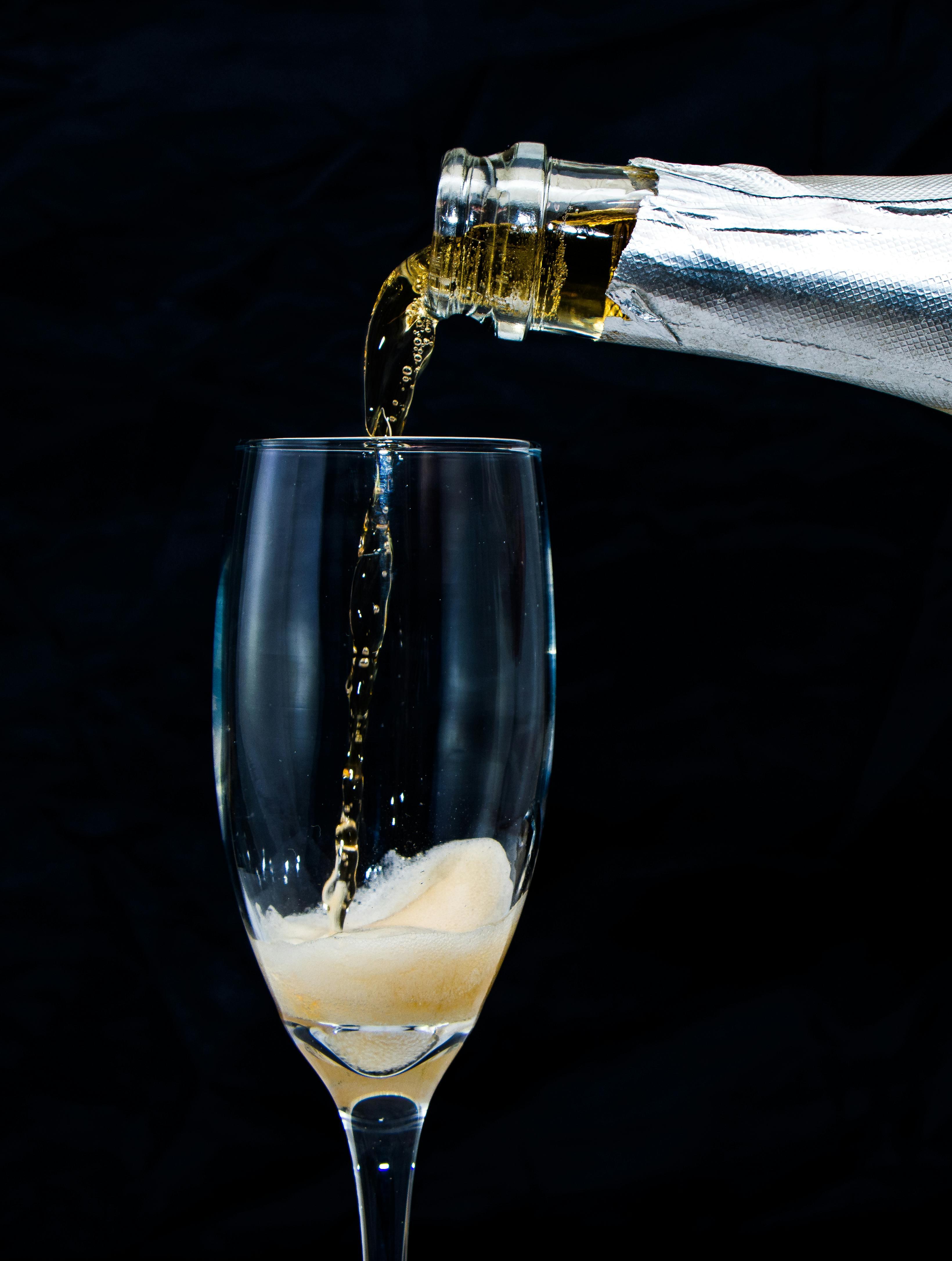 Close-up shot of a champagne-infused coffee in a glass, with condensation