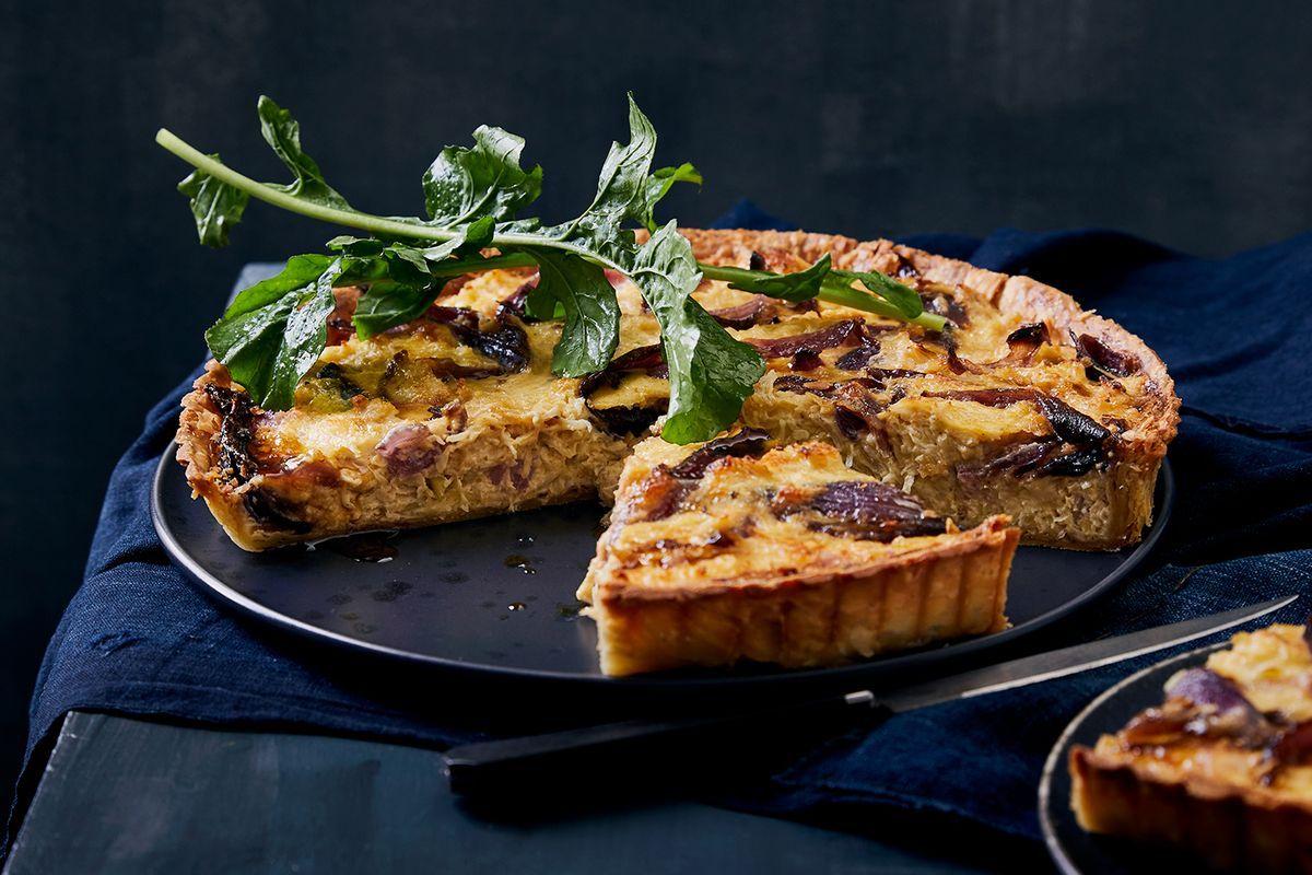 close-up of a slice of sauerkraut and gruyere quiche