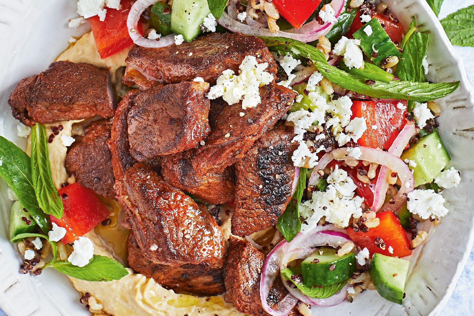 Close-up shot of delicious lamb shawarma with a vibrant barley salad