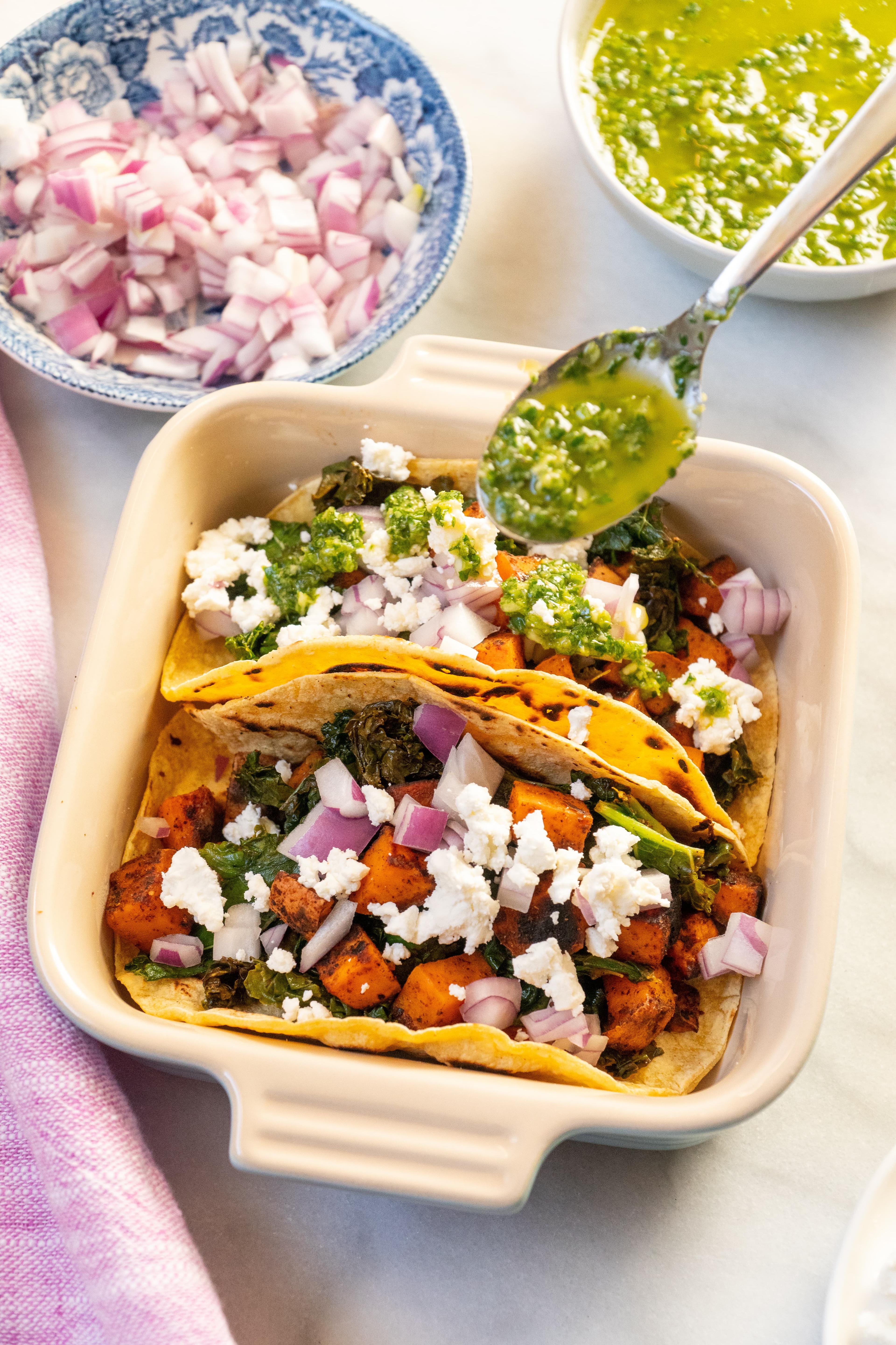 close up shot of assembled sweet potato and kale tacos