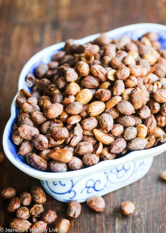 Close-up shot of roasted peanuts with five-spice powder, scattered on a wooden surface