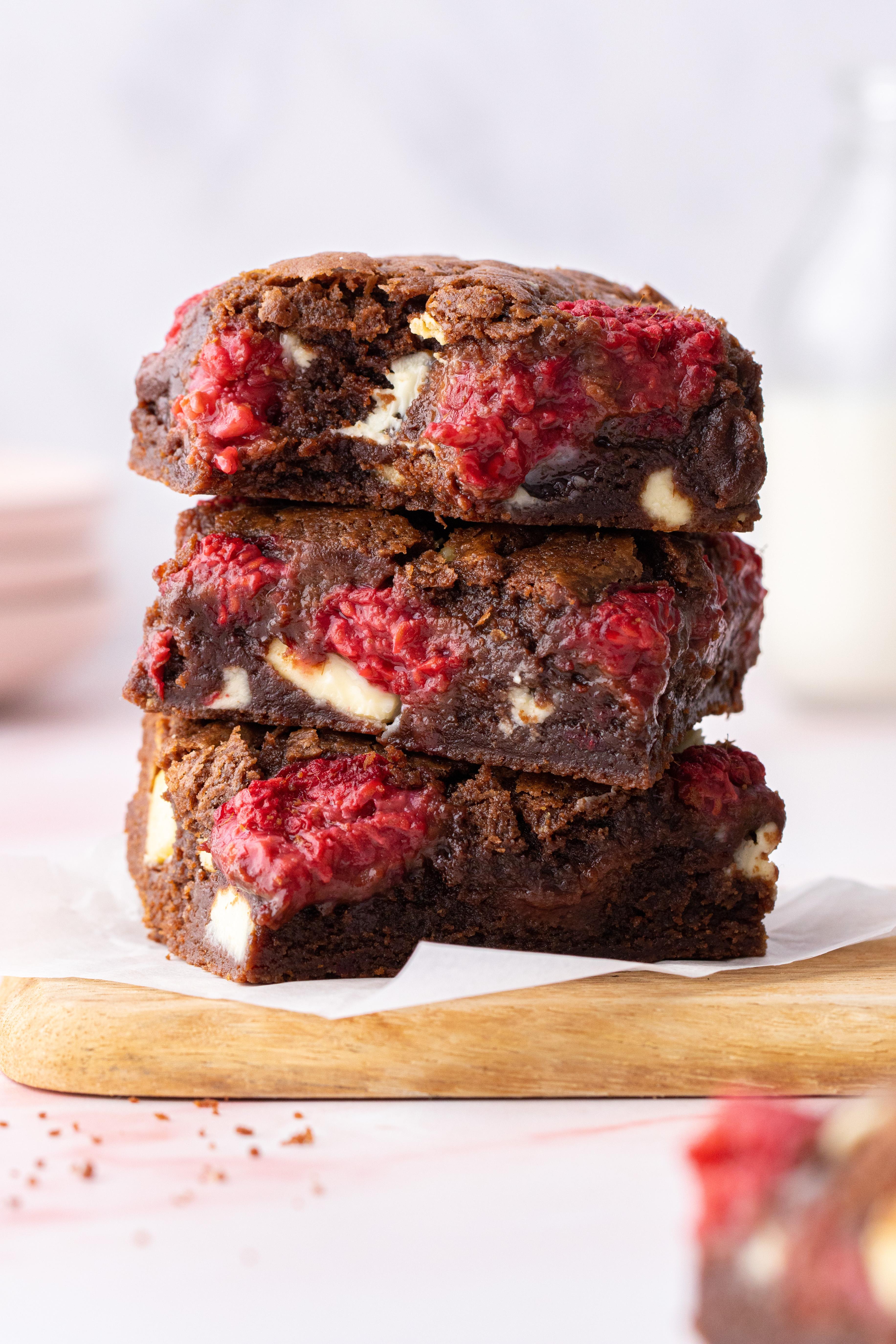 Gooey white chocolate raspberry brownies with fresh raspberries on top