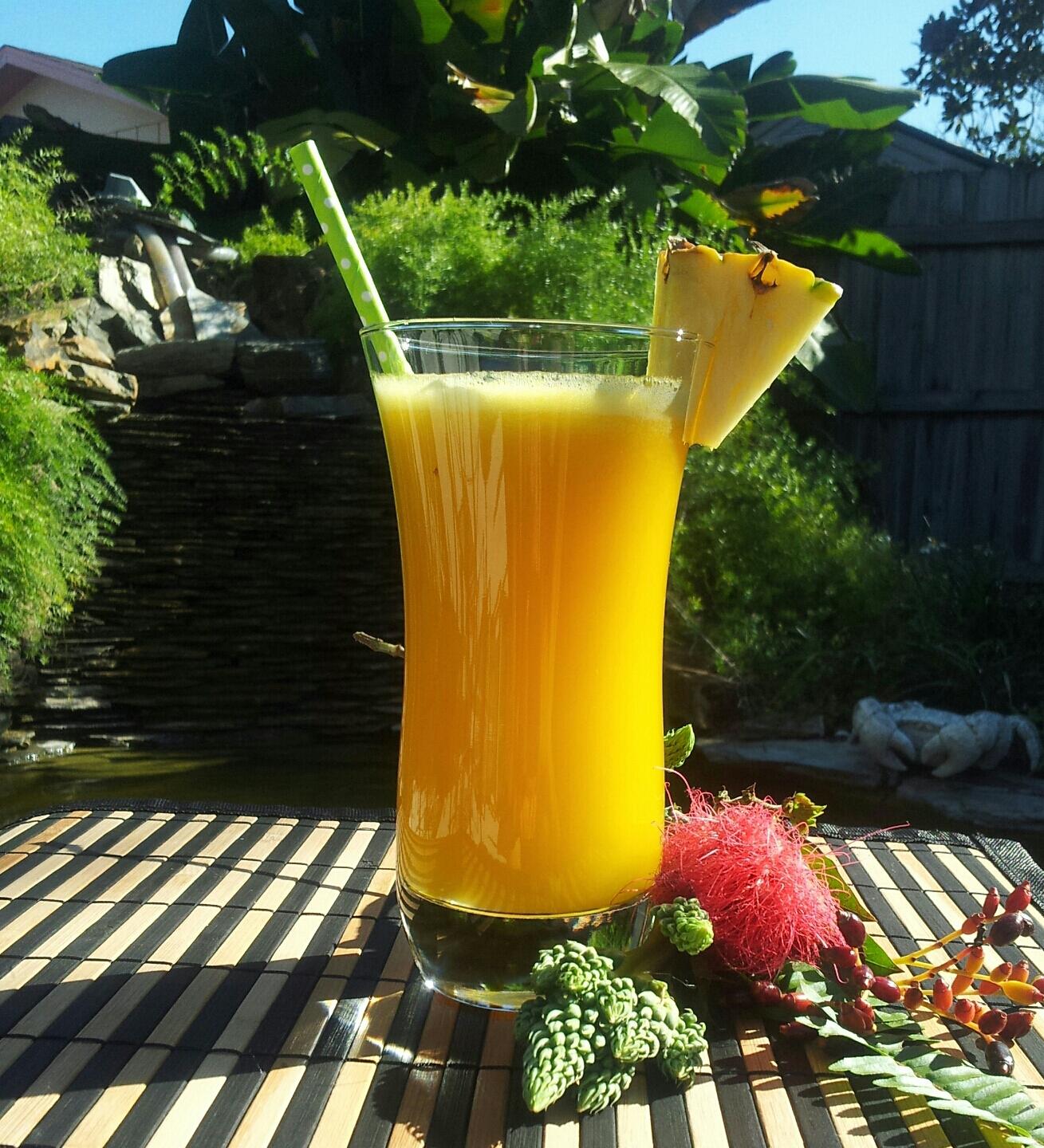 friends enjoying tropical mango tango smoothies outdoors