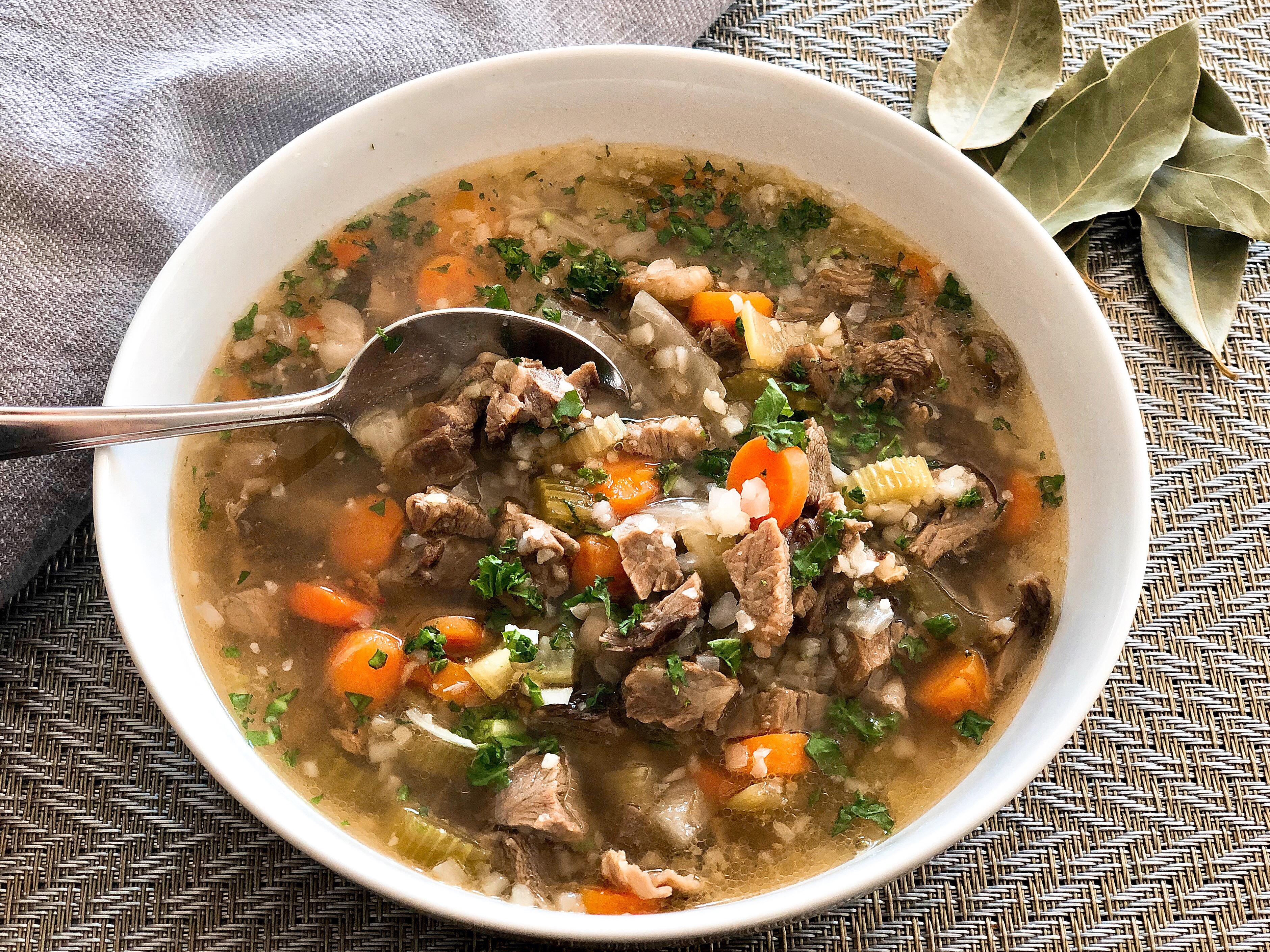 Close up shot of a bowl of Keto Beef Barley Soup with cauliflower rice