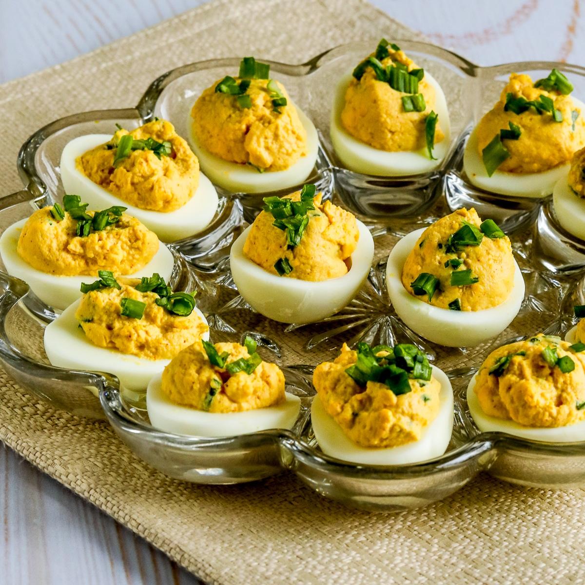Sweet potato and chipotle deviled eggs on a white background