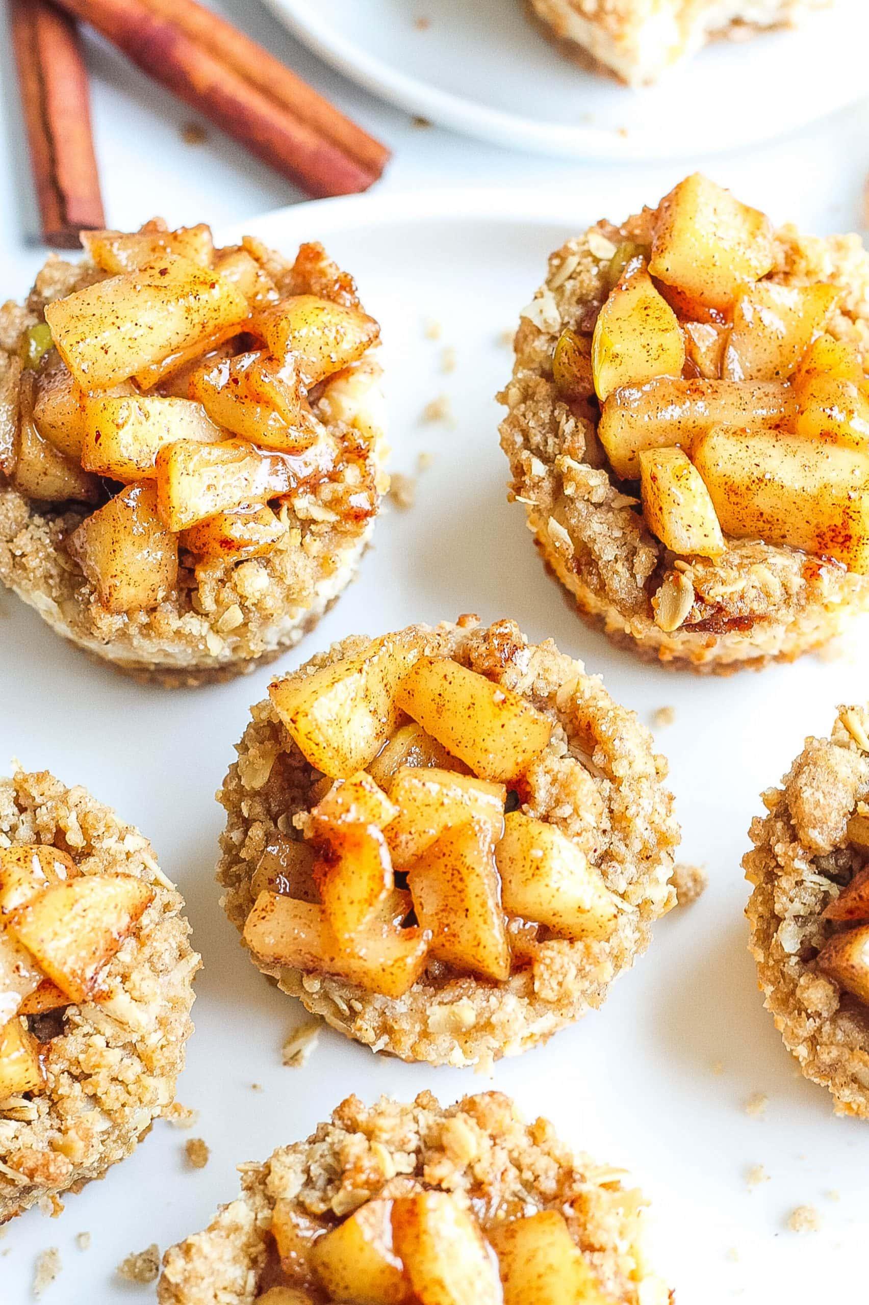 close-up shot of apple pie cheesecake bites on a white plate