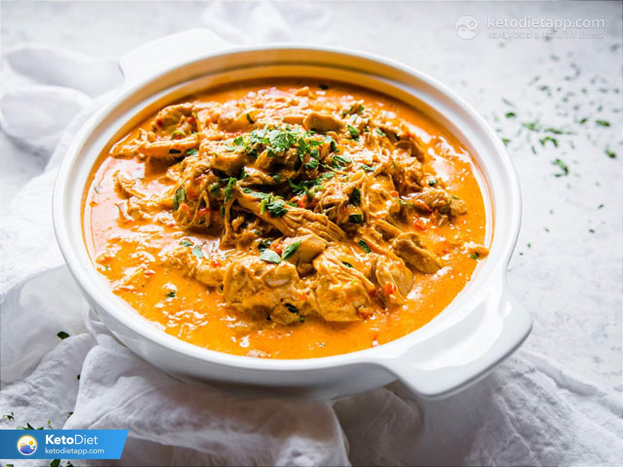 A close-up shot of the chicken paprikash stew with a spoon resting in the bowl