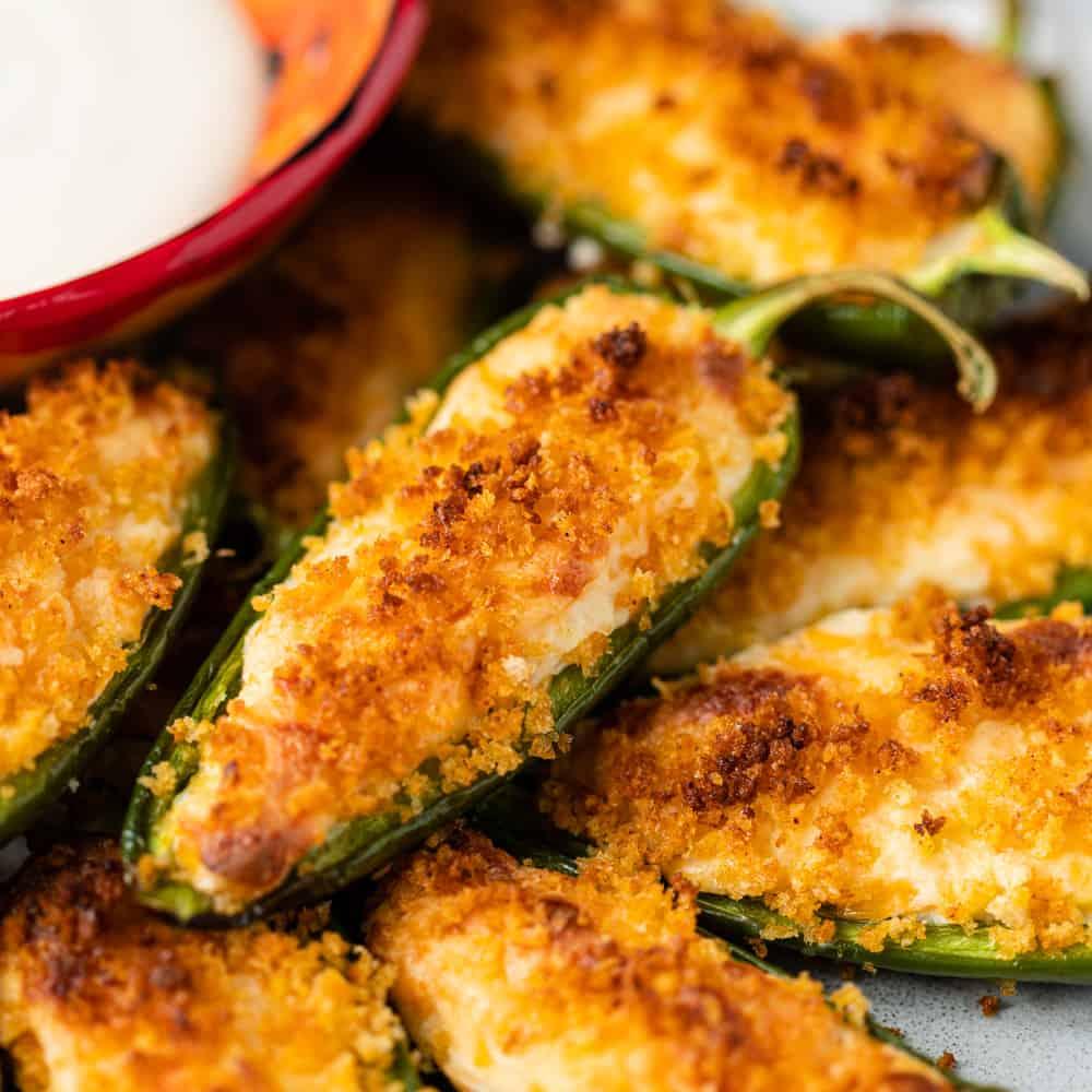 Close-up shot of cheesy jalapeño popper stuffed peppers