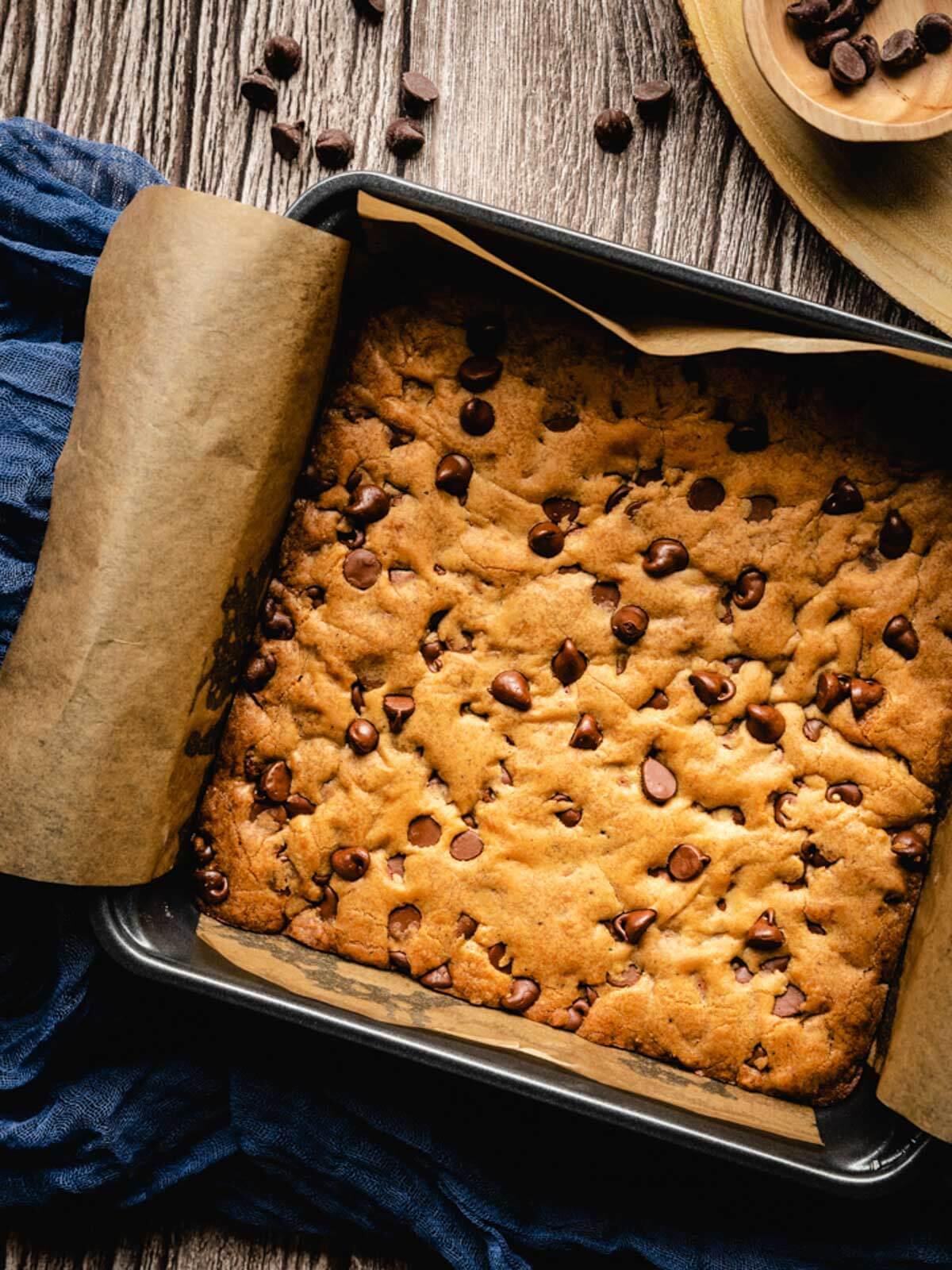 A baking pan full of freshly baked chocolate chip blondies