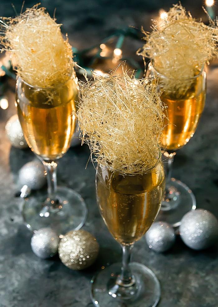 overhead view of finished champagne lollipops on a parchment paper
