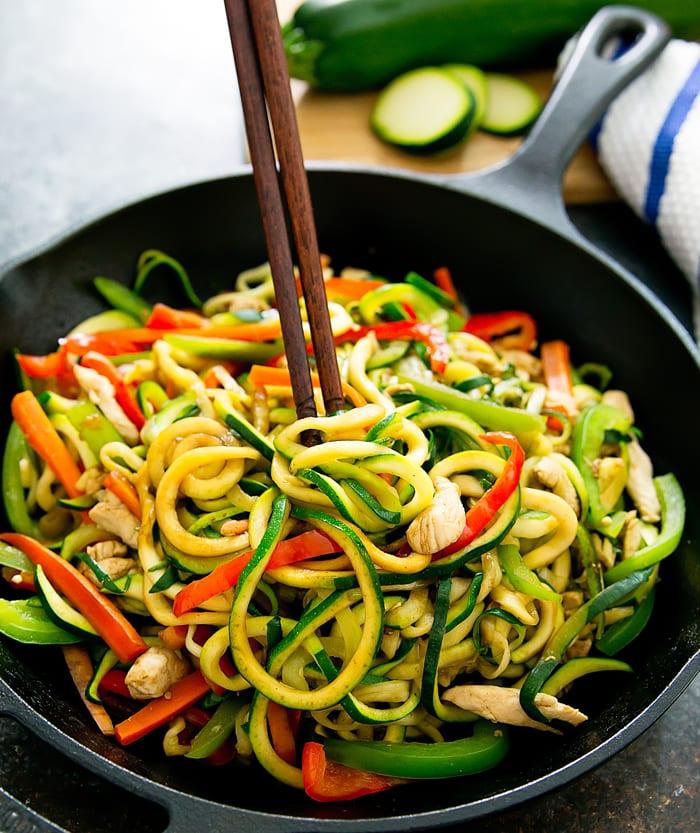 A close-up shot of a delicious zucchini noodle stir-fry