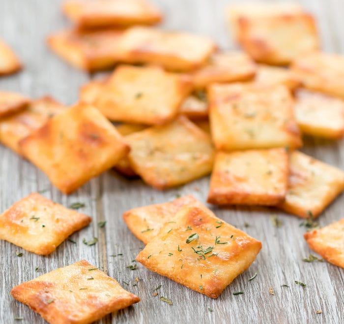 close-up shot of keto cheddar and apple crackers on a baking sheet