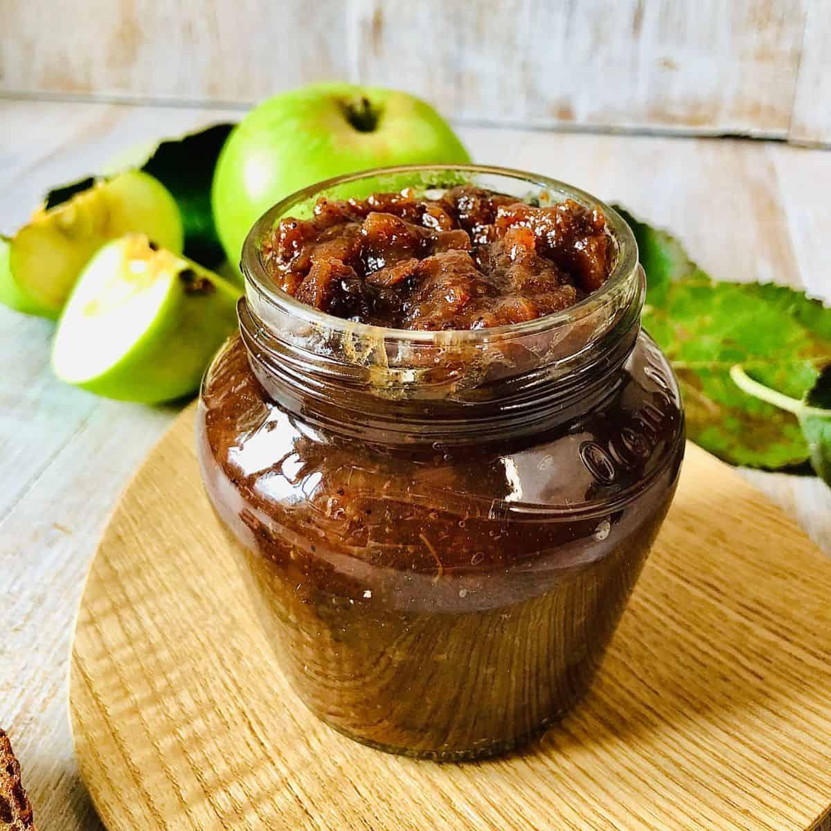 Close up shot of a spoonful of Turnip and Apple Chutney, showcasing its texture and color