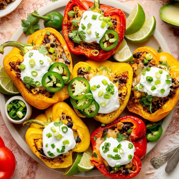 Ingredients for Tortilla Española stuffed bell peppers: potatoes, onions, eggs, bell peppers, and quinoa