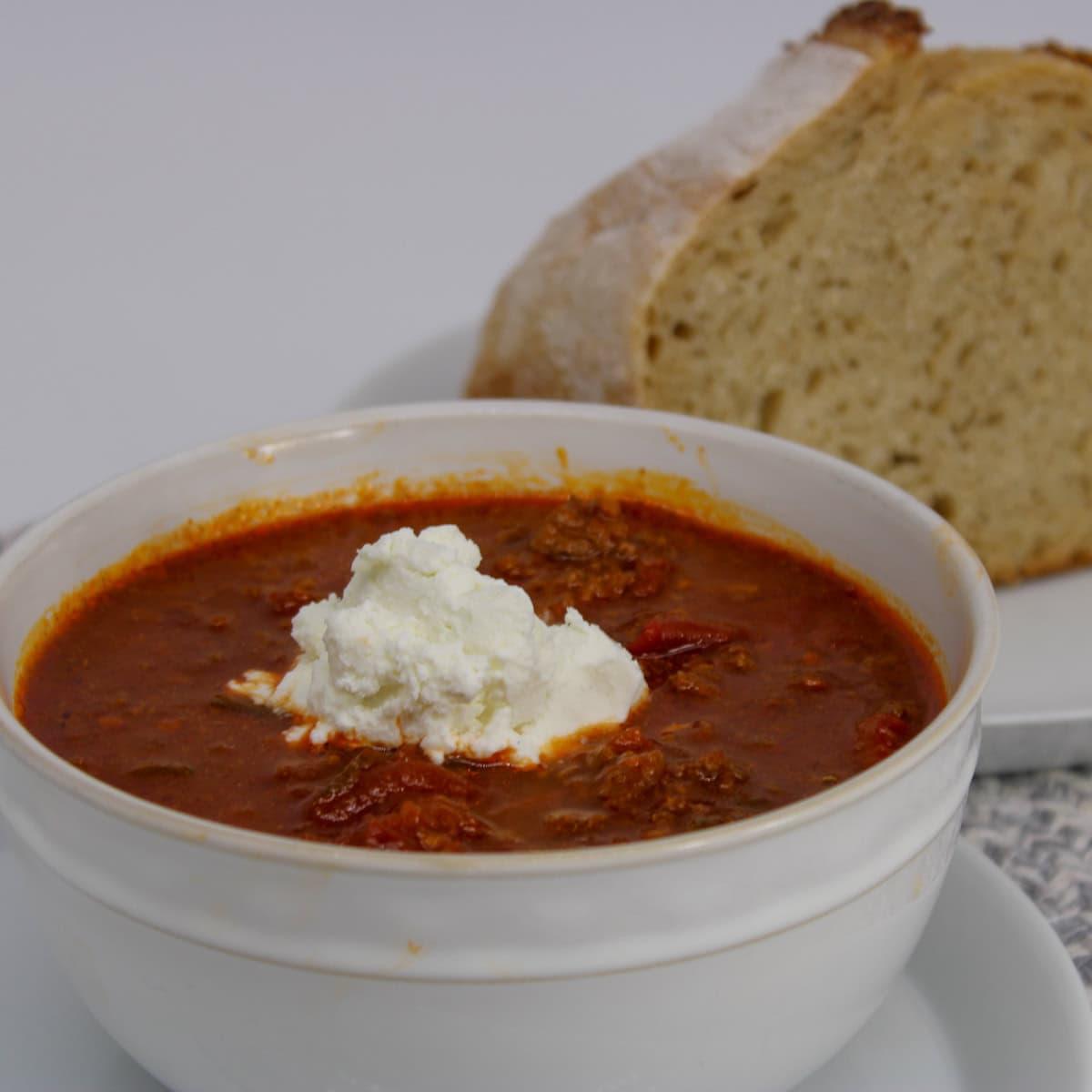 slow cooker filled with creamy goat cheese and fig chili simmering gently