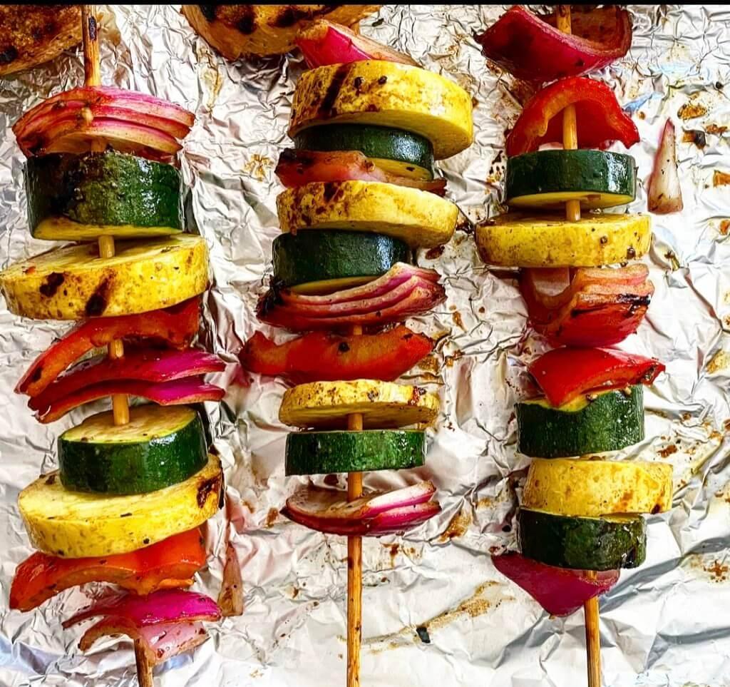 Colorful grilled vegetable skewers with balsamic glaze drizzled on top