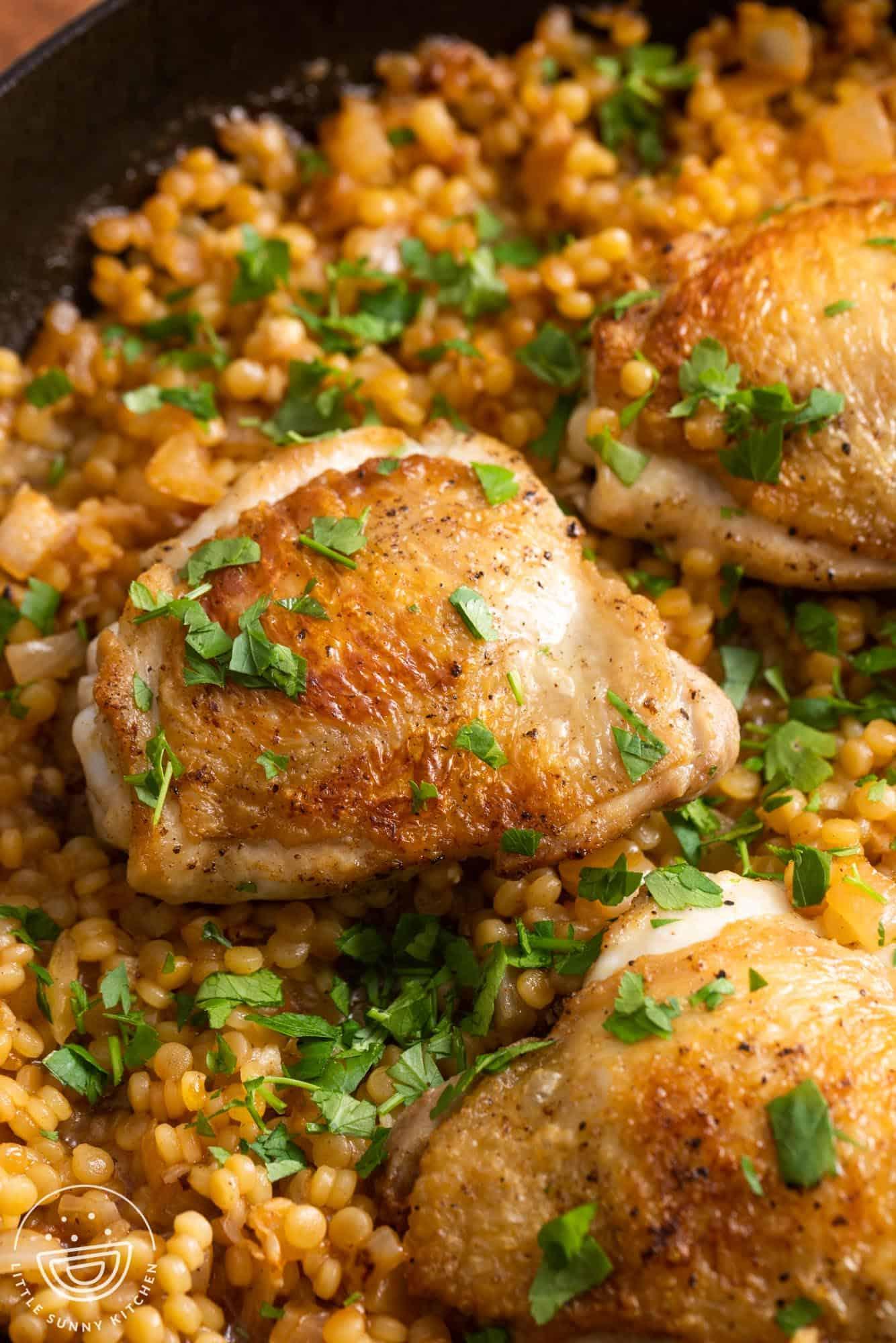 A close-up of the shredded chicken and couscous mixture, highlighting the texture and colors