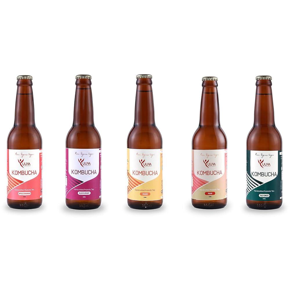 various bottles of kombucha with different flavorings, including lavender and cranberries