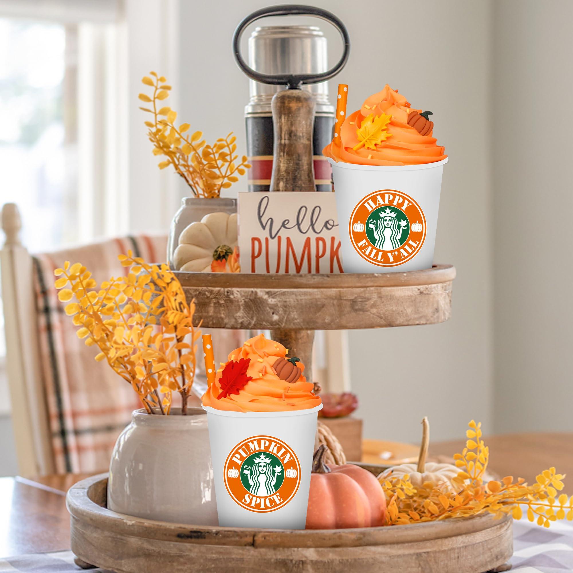 A table set for two with Pumpkin spice latte smoothies, autumn leaves and pumpkins as decor