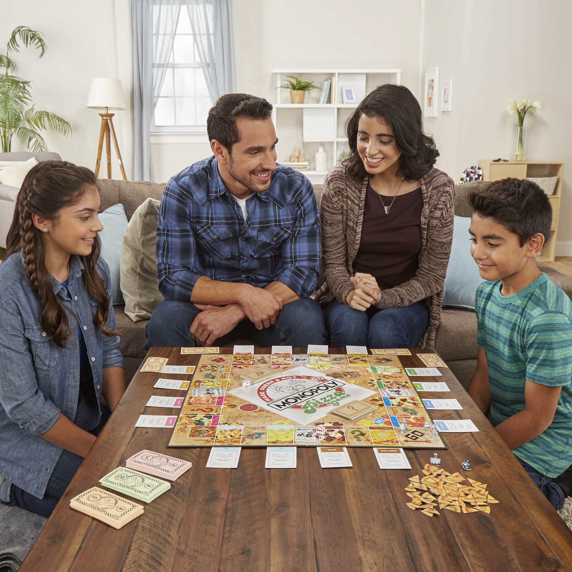 A family gathered around a table playing board games and enjoying a homemade pizza