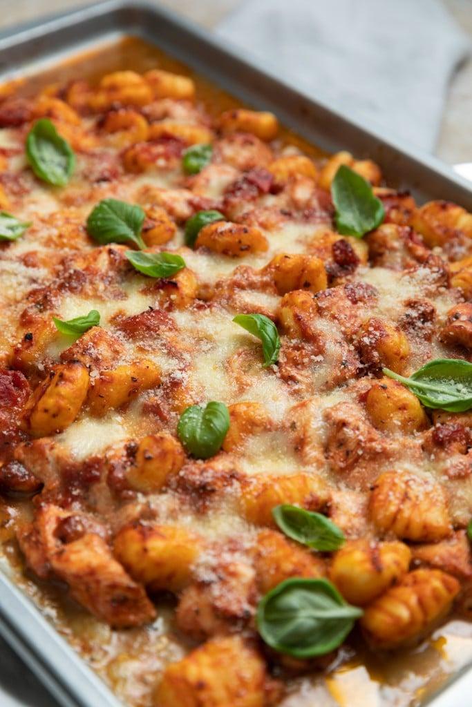 close up of sheet pan roasted chicken and gnocchi