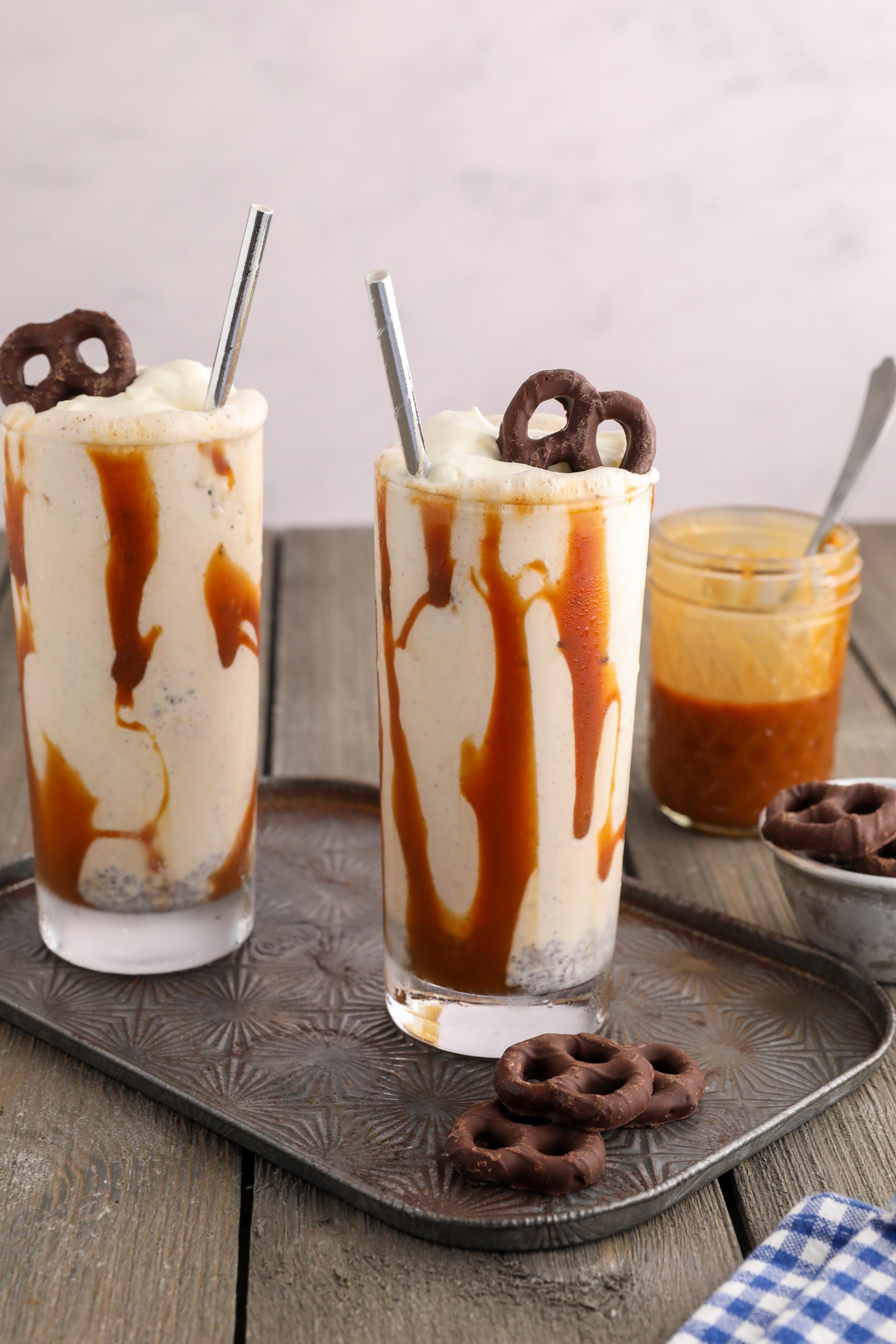 Close-up shot of a Beer Pretzel Milkshake with pretzel sticks in the glass