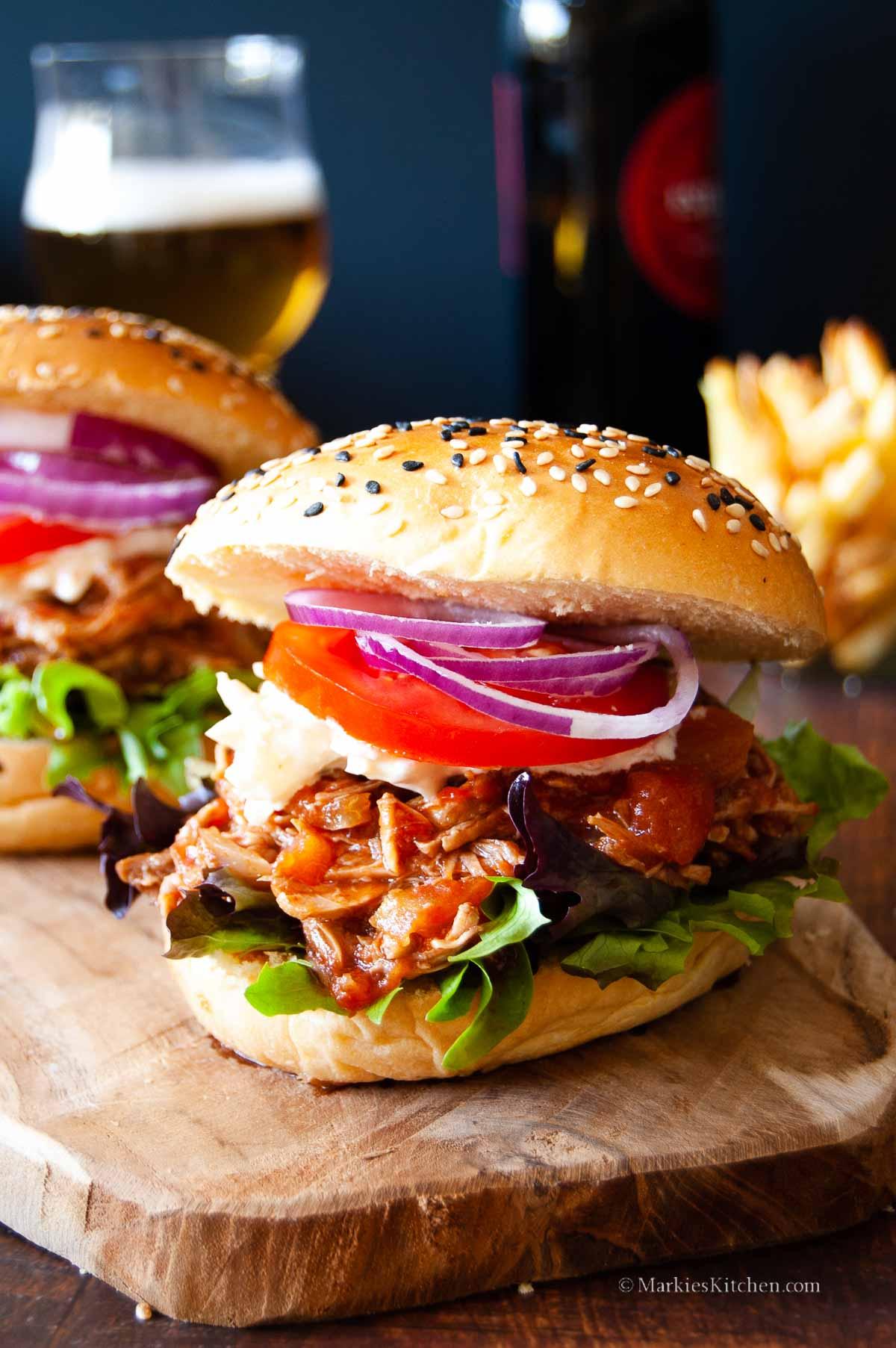 Close up of a delicious pulled pork burger with all the fixings
