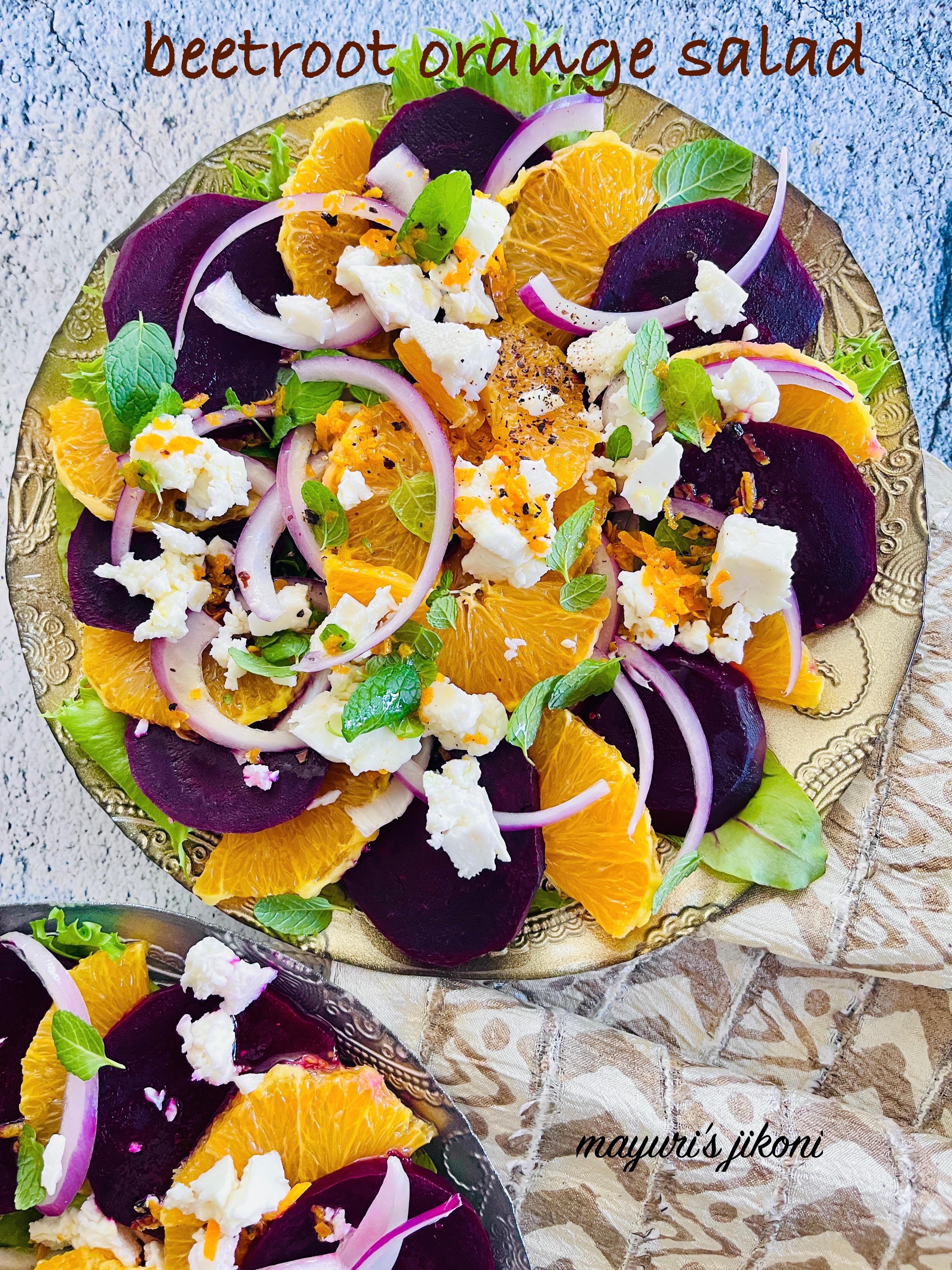 Close-up of the vibrant colors of the beetroot and orange salad