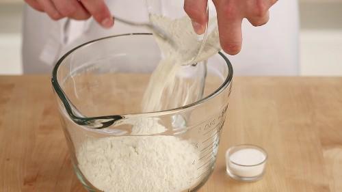 masarepa flour being poured into a bowl