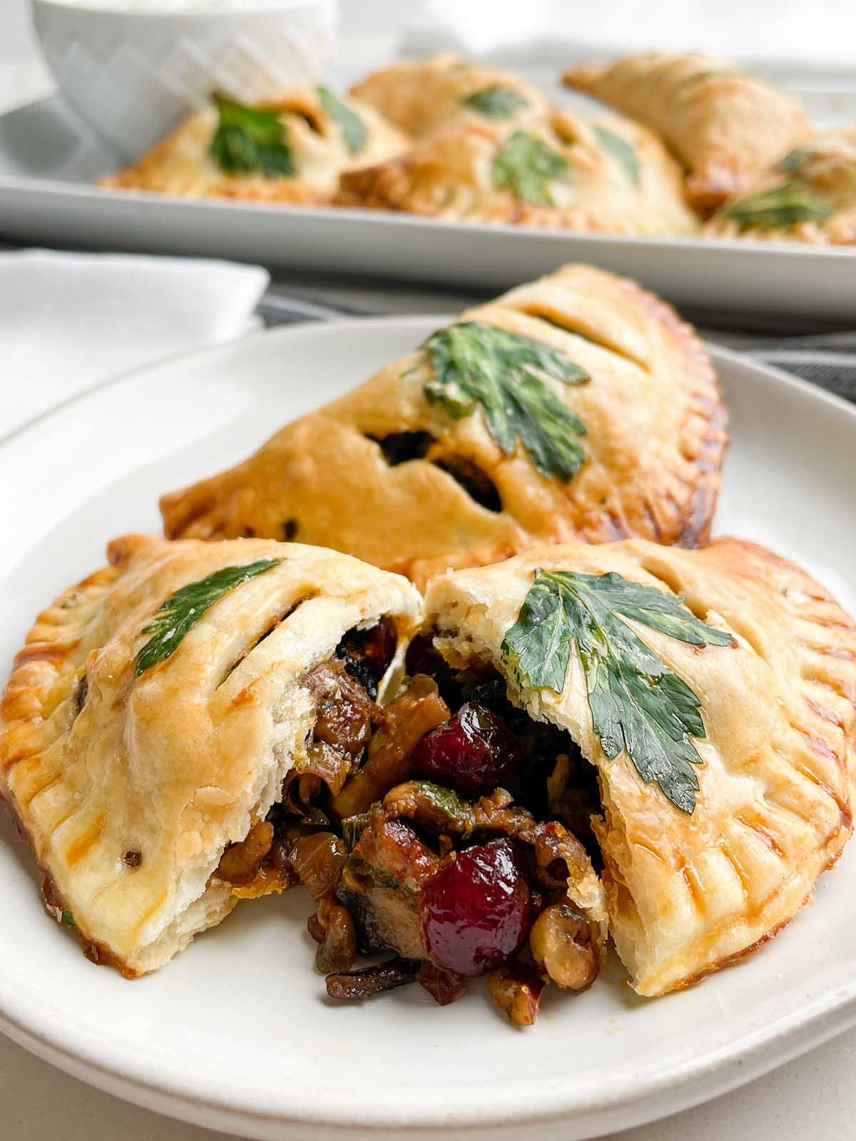 golden brown roasted vegetable empanadas drizzled with balsamic glaze