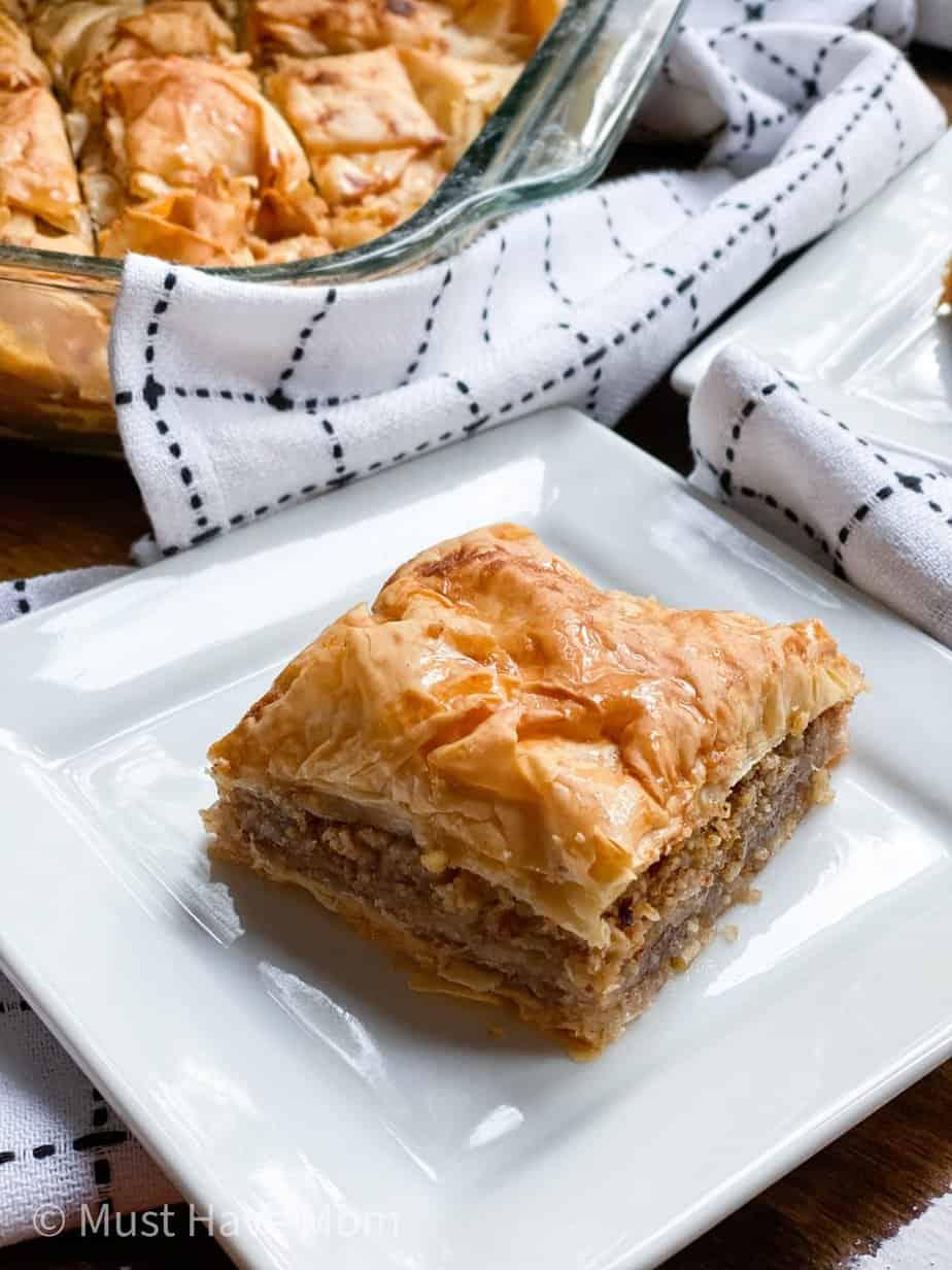 finished collard greens baklava petals being drizzled with honey syrup