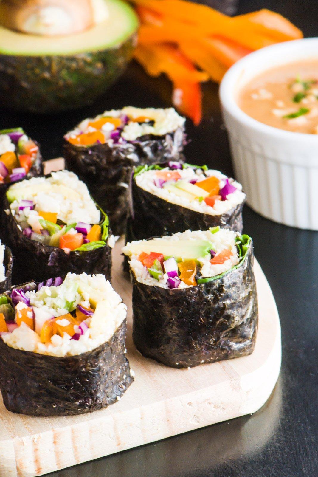 Close-up shot of a delicious cauliflower rice sushi roll, showcasing vibrant colors and fresh ingredients