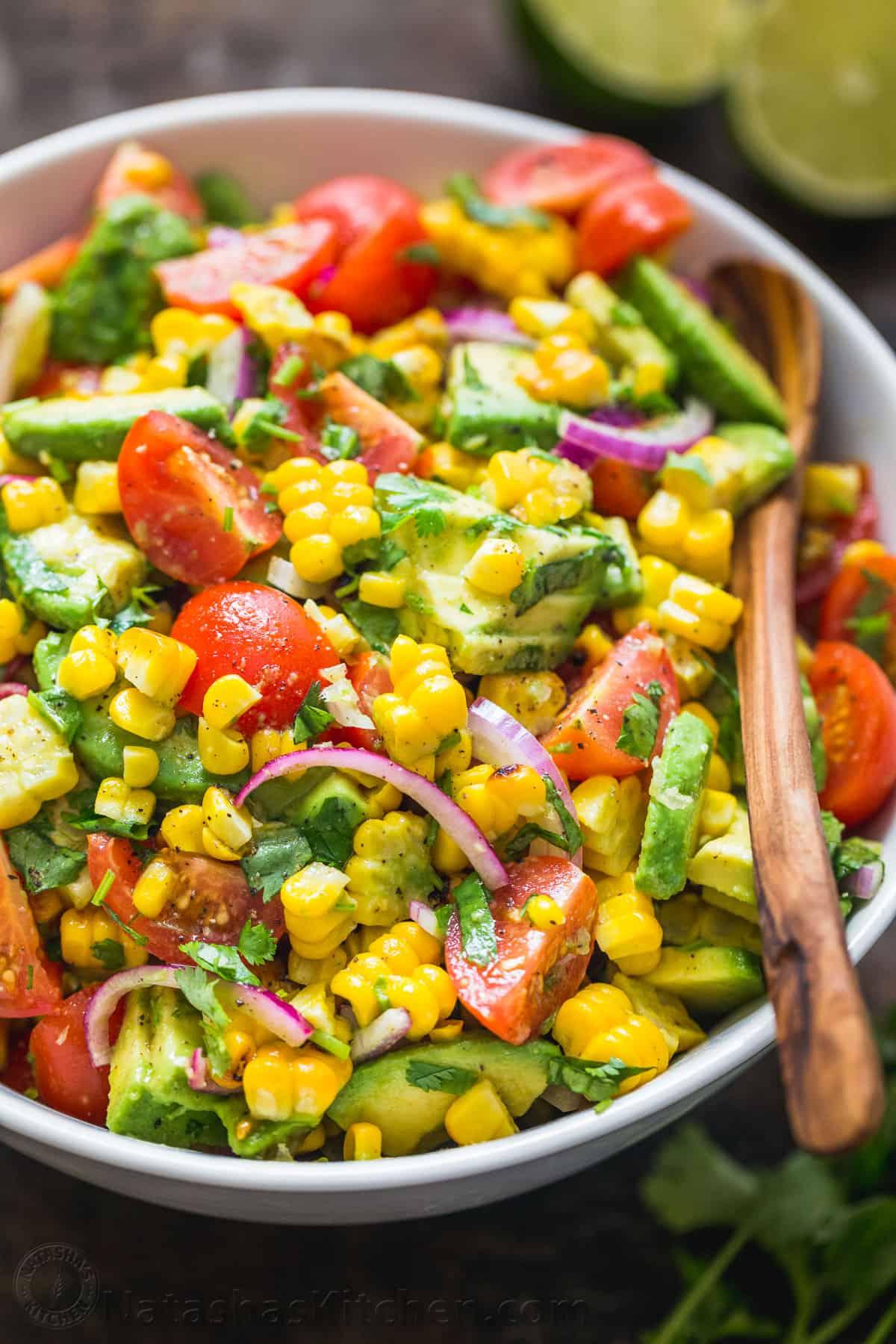 bright and colorful corn and avocado salad with lime dressing