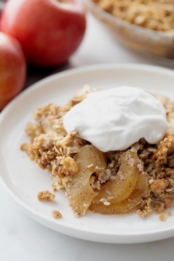Close up shot of a warm apple crisp with cream cheese swirl, steam rising