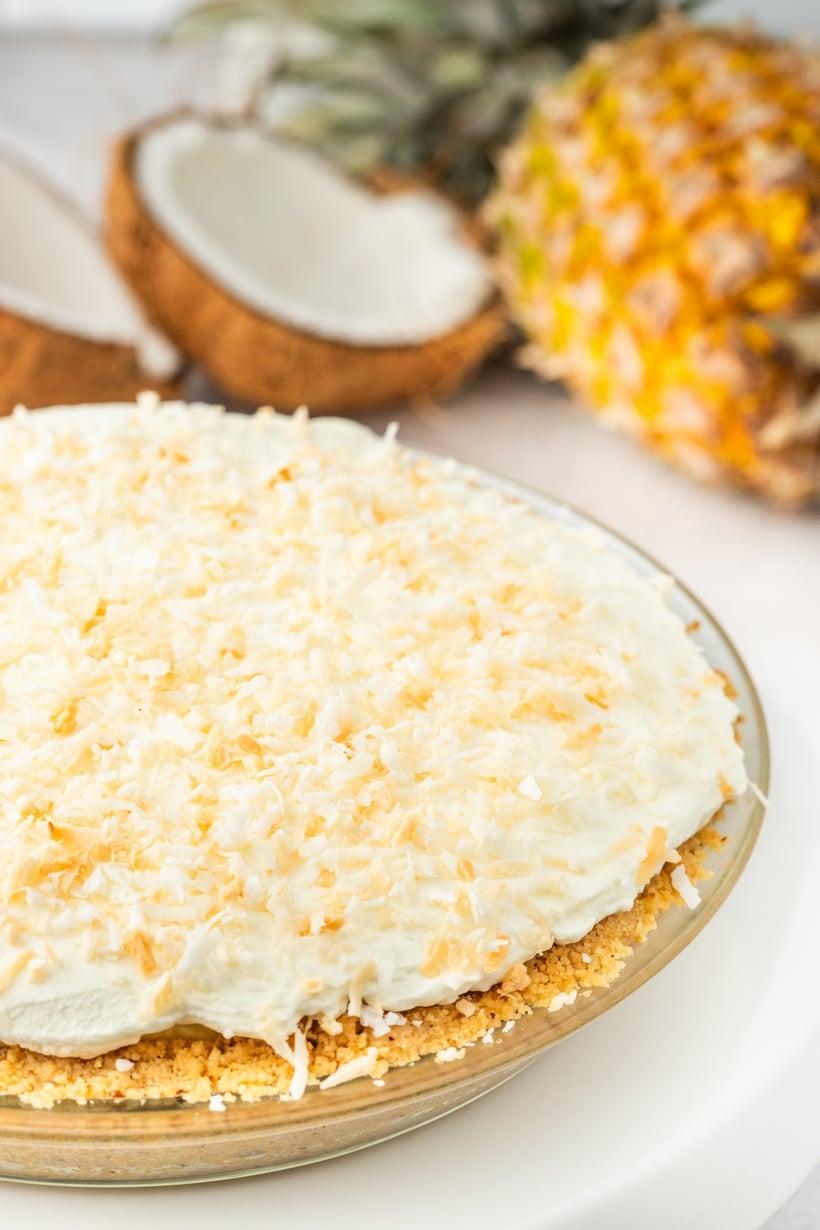 overhead shot of a whole pineapple coconut cream pie