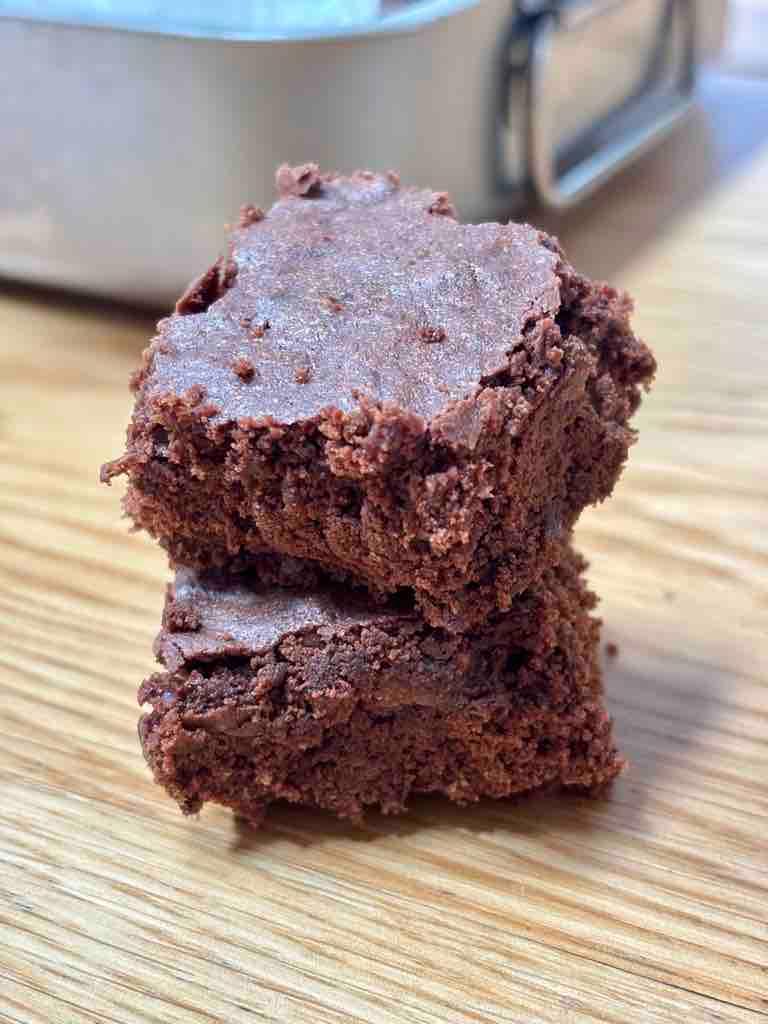 Ingredients for espresso brownies arranged on a wooden surface